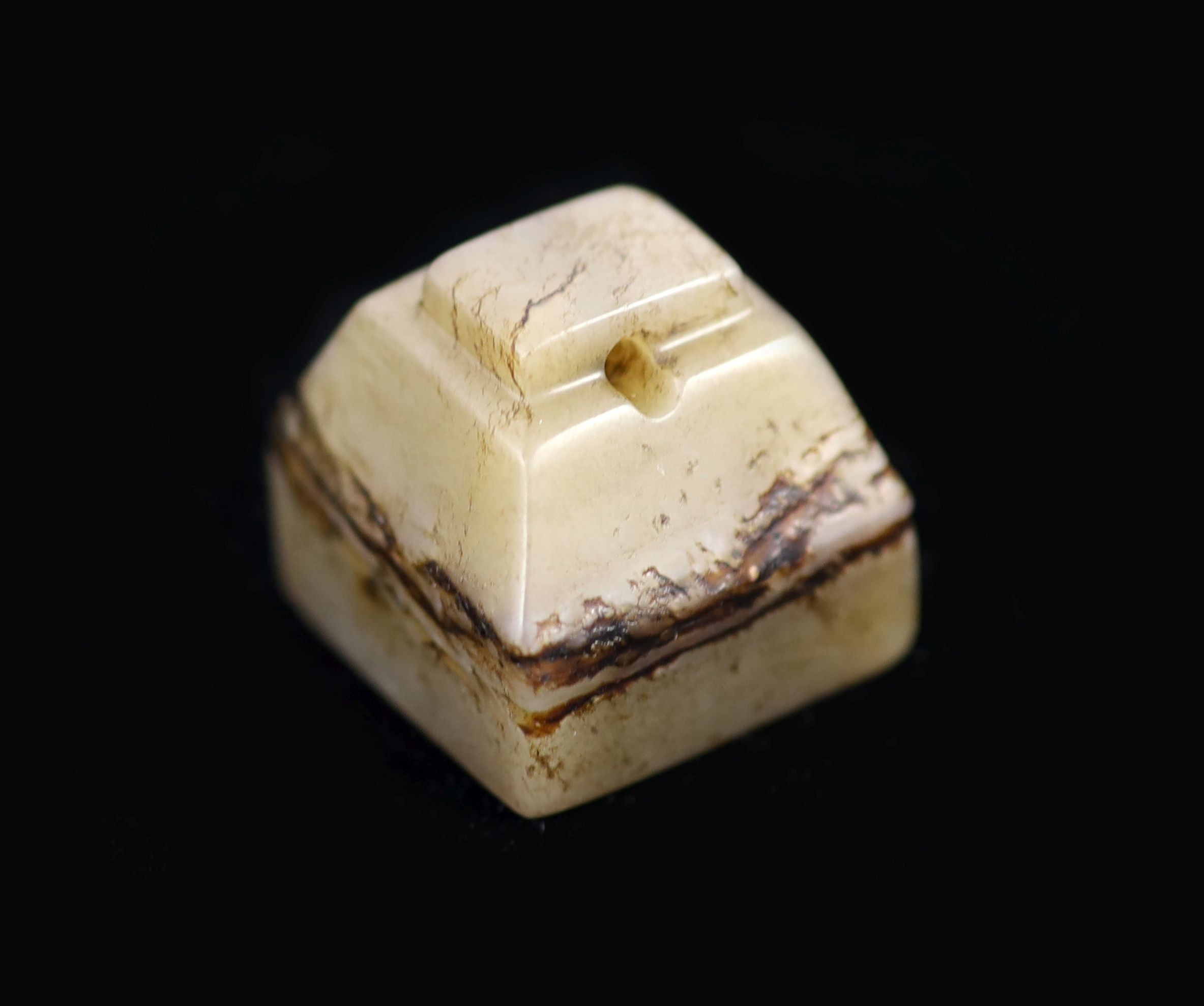 A Chinese grey and black jade square seal, 2.7cm
